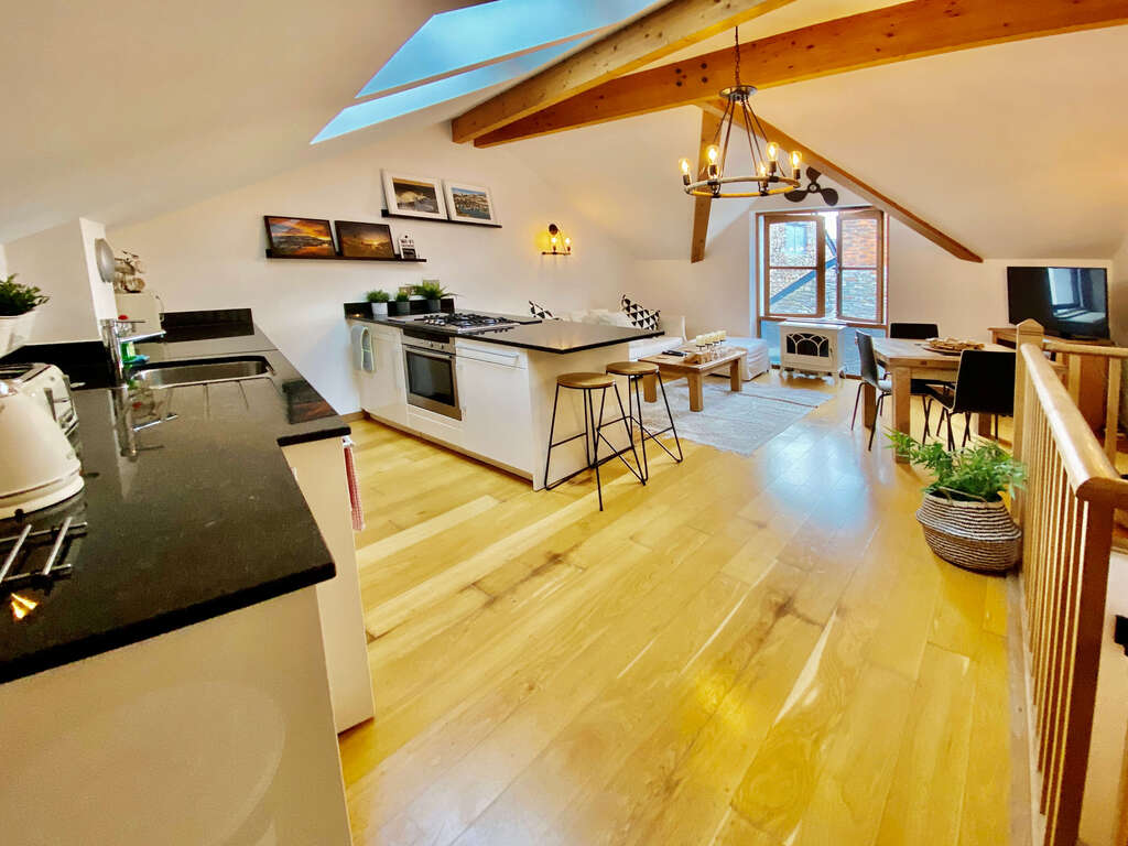 Brixham Holiday Let - Loft family room with lounge and kitchen